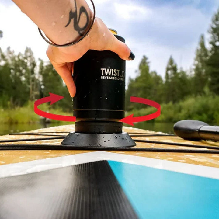 Person using a Twistlock beverage holder and can cooler set on a kayak with a scenic background