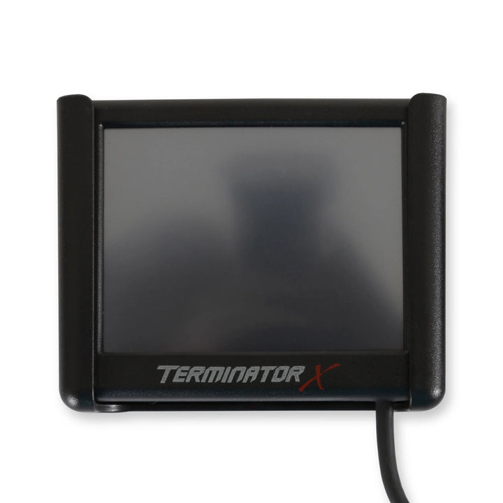 A black Terminator X LCD tuning display with a dark screen and a visible cable, shown on a plain white background.