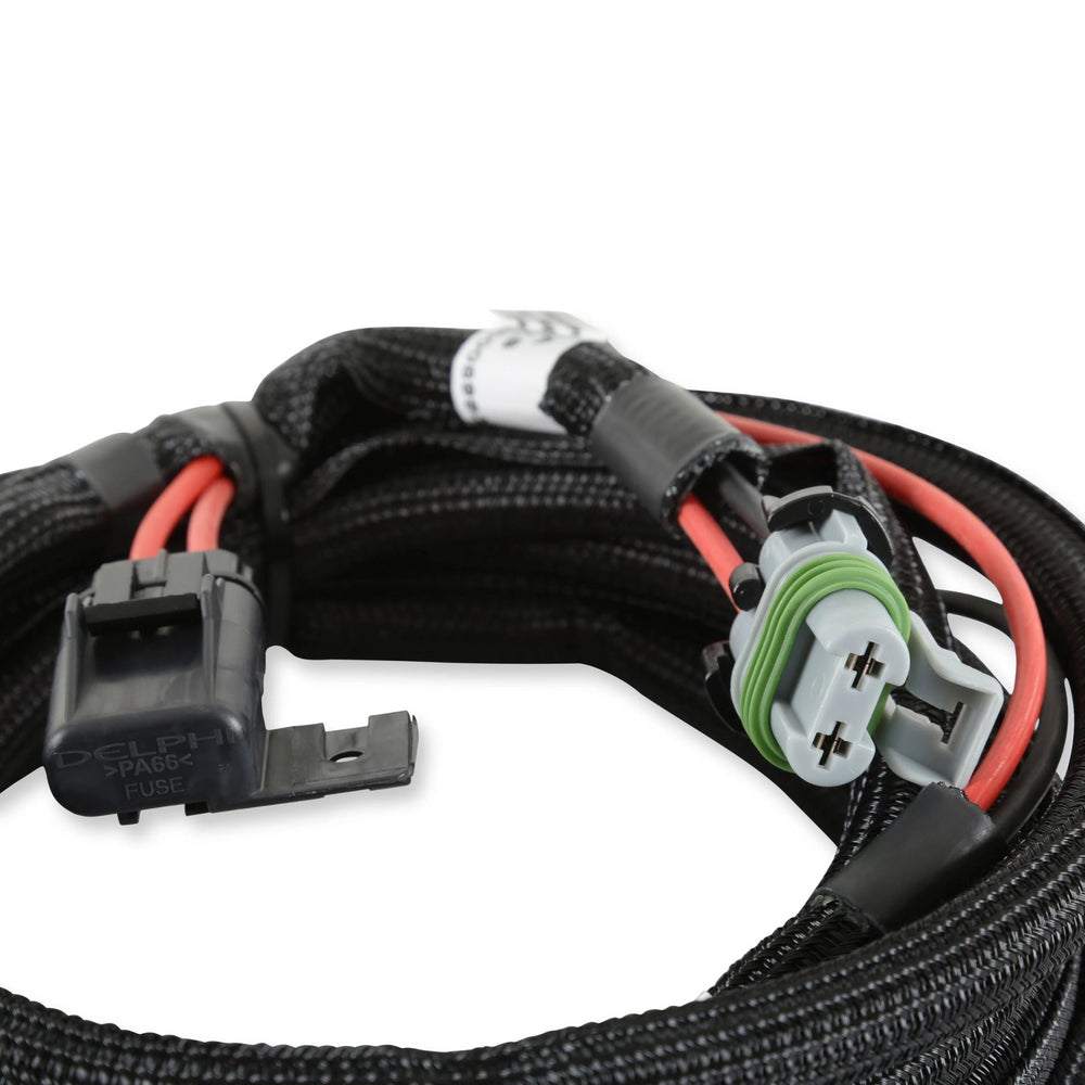 Close-up of a coiled Holley HP EFI battery power harness with connectors on a white background