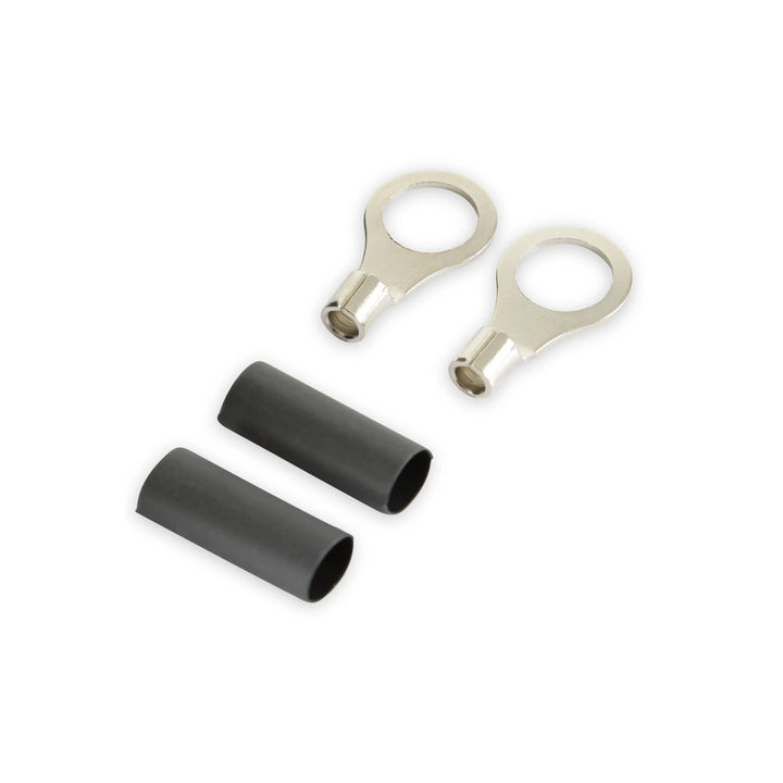 Two silver metal ring terminal connectors with black protective sleeve covers for Holley Dominator EFI main power cable shown on a plain white background.
