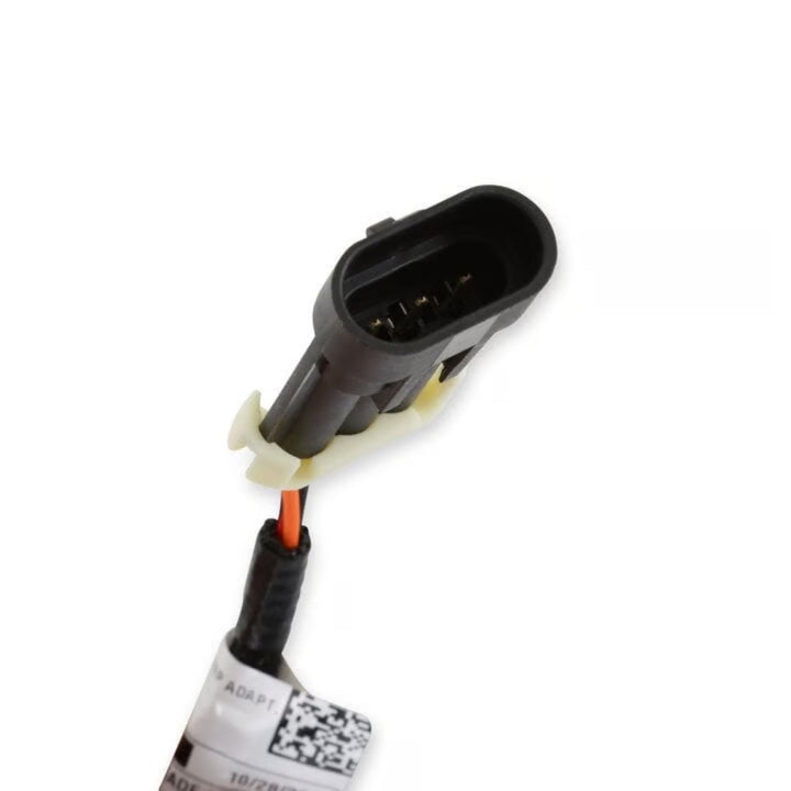 A black LS Hi-Ram MAP sensor adapter harness with a white plastic release tab and a single orange wire, shown on a white background with a product tag attached.