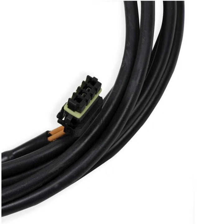 A close-up of a black Holley EFI 558-443 CAN bus cable with a multi-pin connector, showing orange wire strands and a light green insulator, on a white background.