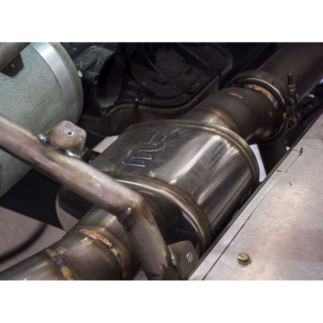 Close-up of a rock crawler exhaust with straight through muffler for off road exhaust system.