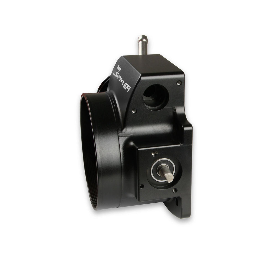 A black metal cable operated 102mm LS throttle body with connector tip and a small silver switch, shown on a white background.