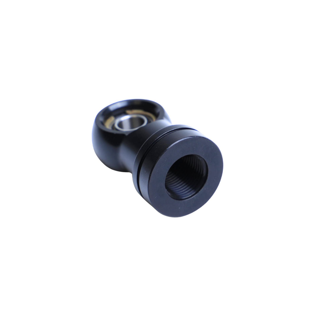 Black Radflo shock shaft eyelet assembly on a white background
