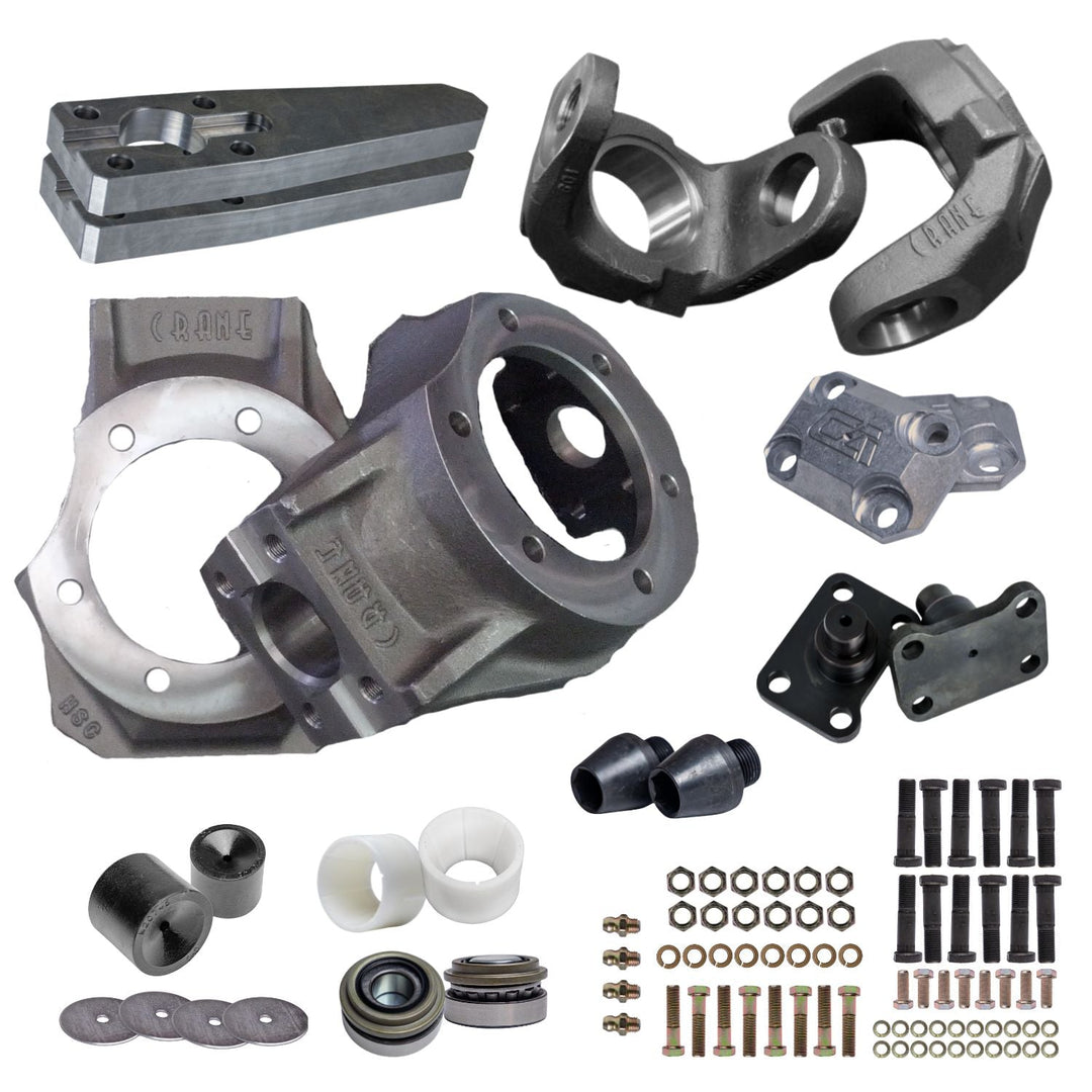 Collection of GM Dana 60 steering knuckle kit parts and hardware on a white background