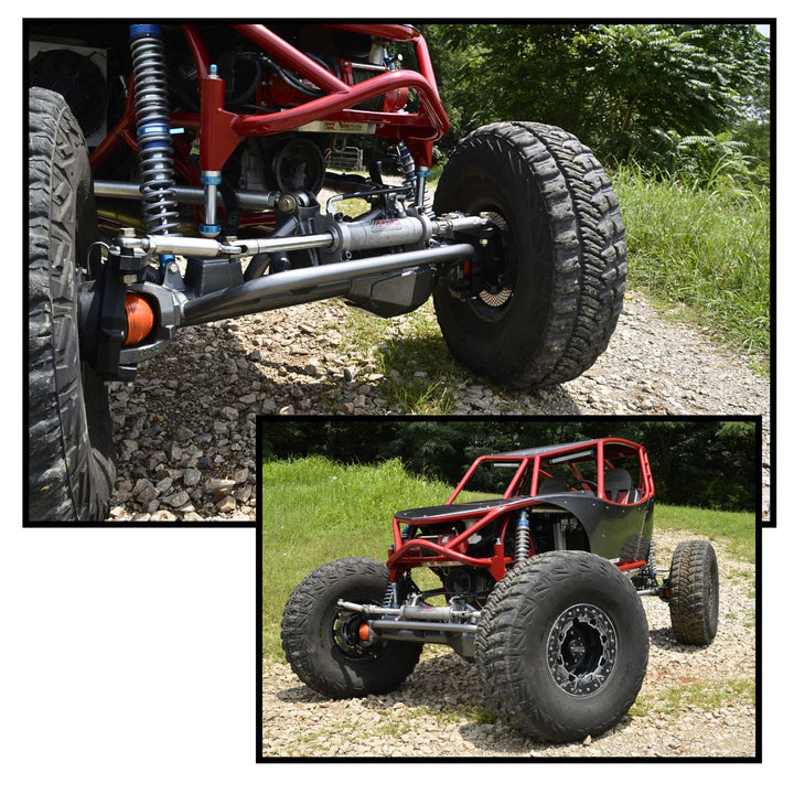 Close-up of a red off-road vehicle chassis withCrane Axle Dana 60 kit and large tires on a natural background.