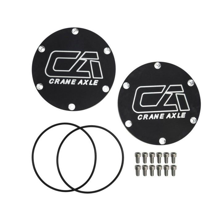 Two black 2005+ Super Duty unit bearing covers with Crane Axle logo and additional components on a white background