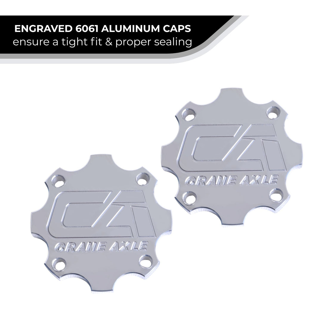 Two engraved 6061 aluminum 40 spline drive flange caps with a &