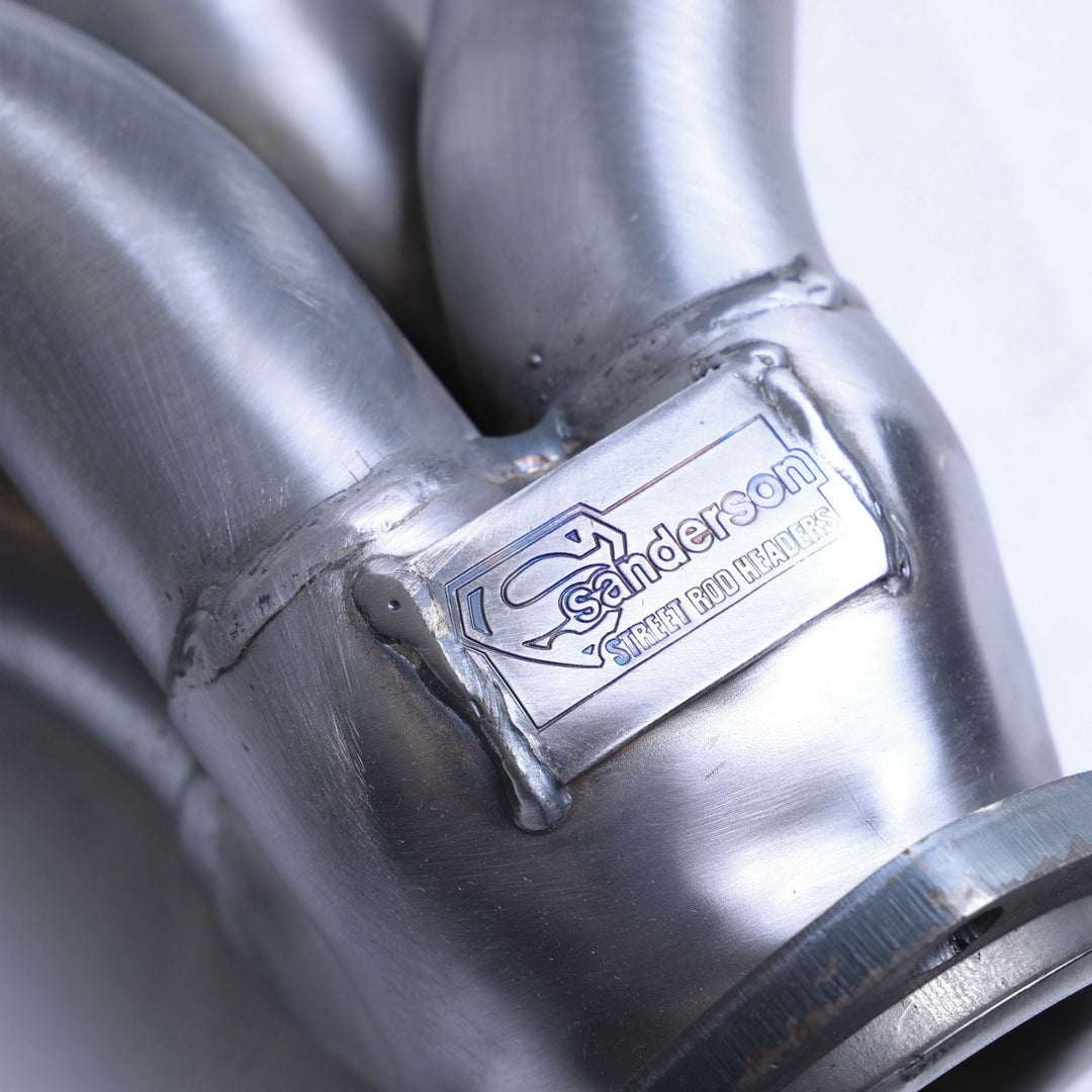 Close-up of a steel header hugger with &
