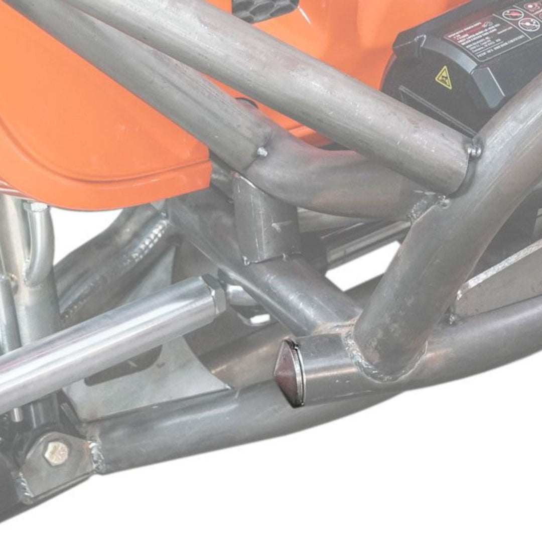 Close-up of a chassis frame with a  rounded steel tube plug on a white background