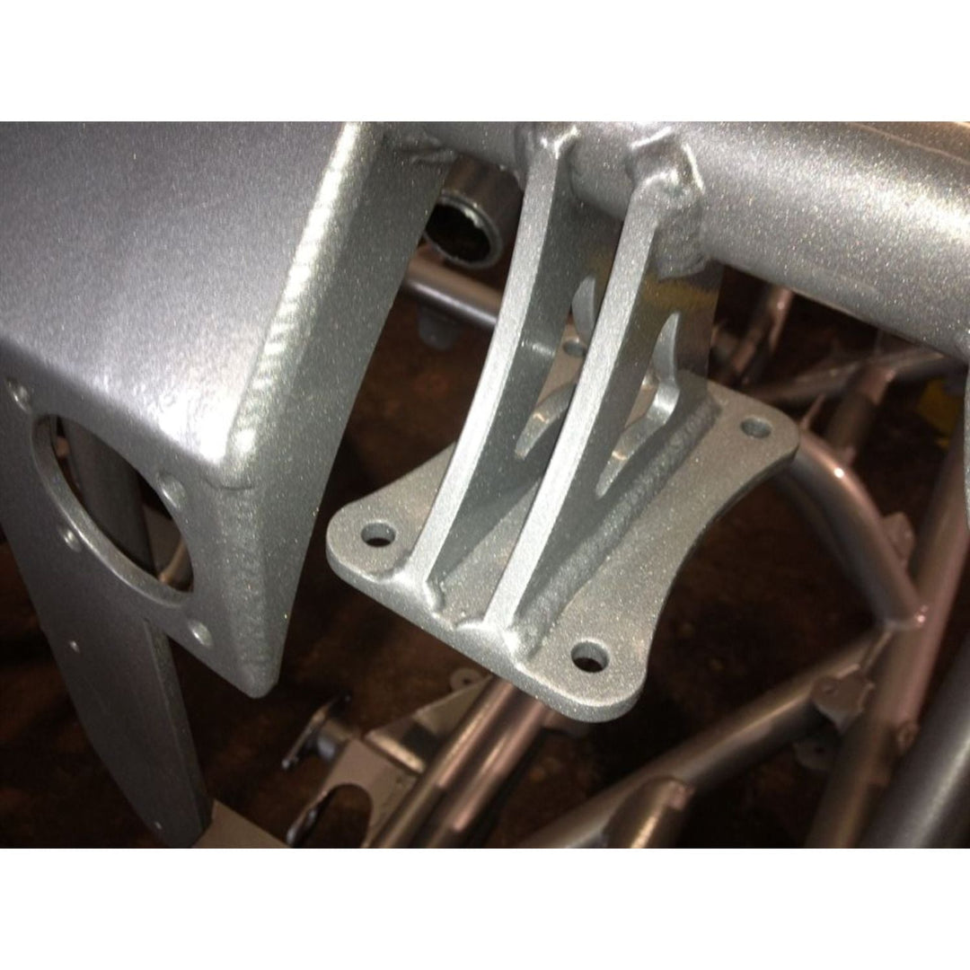 Close-up of wilwood swing pedal bracket welded on a chassis