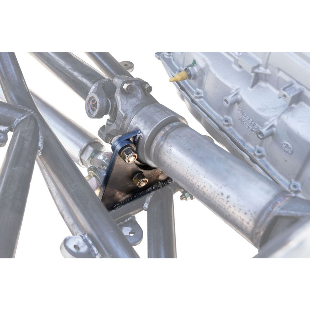 Close-up of a weld on carrier bearing mount with bolts and a white background