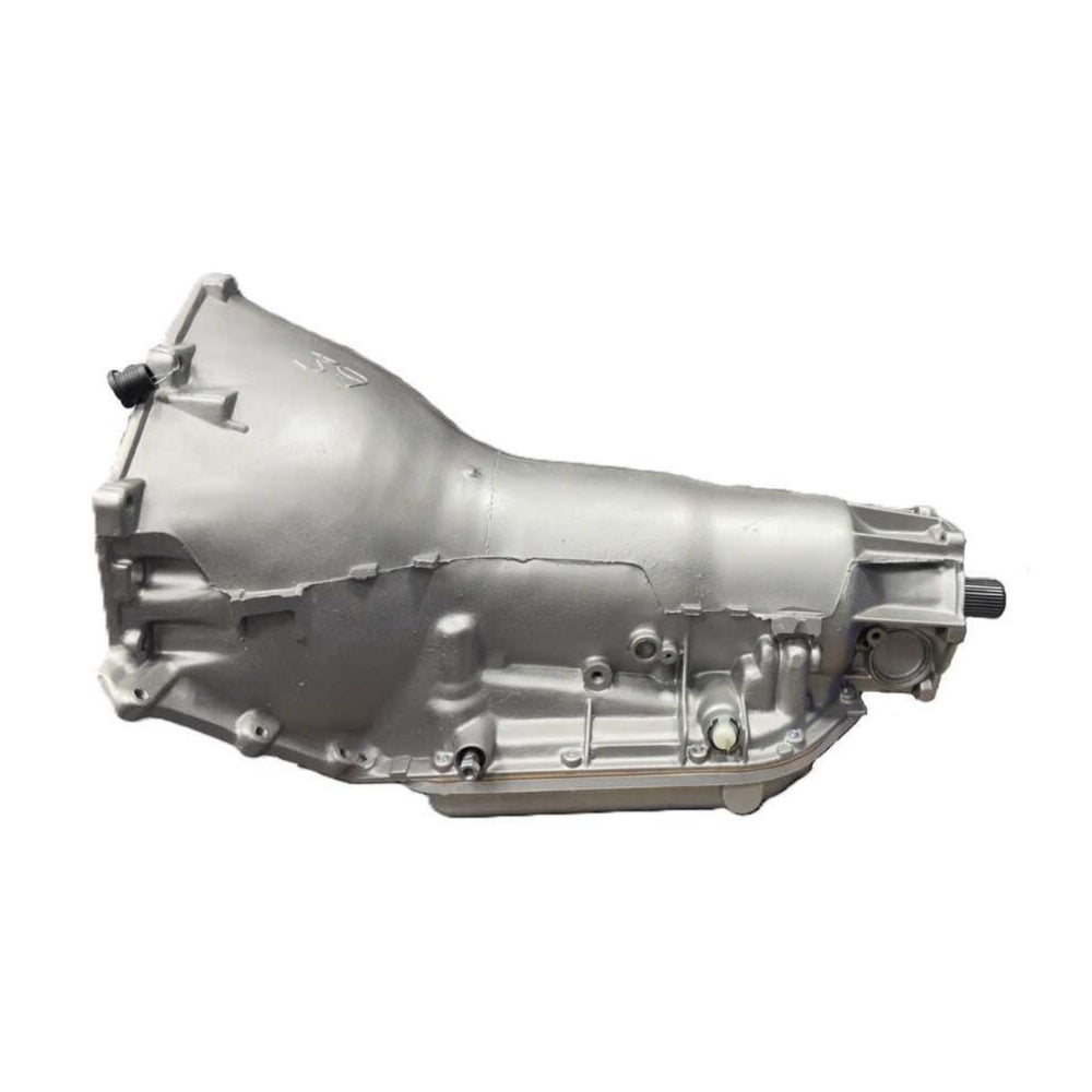 A silver TH400 short output transmission, photographed on a plain white background.