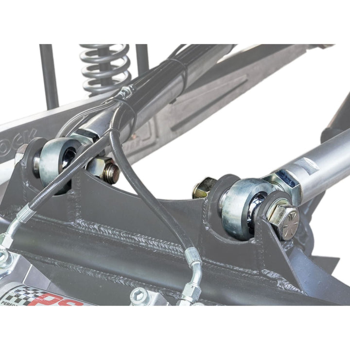 Close-up of competition four link suspension hardware on a race buggy.