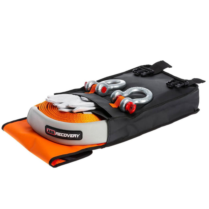 ARB vehicle recovery kit 4WD with shackle and strap in a black and orange bag on a white background