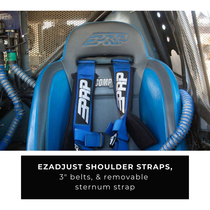 Blue  PRP bolt in 4 point harness with EZAdjust shoulder straps in a rock crawler  interior.