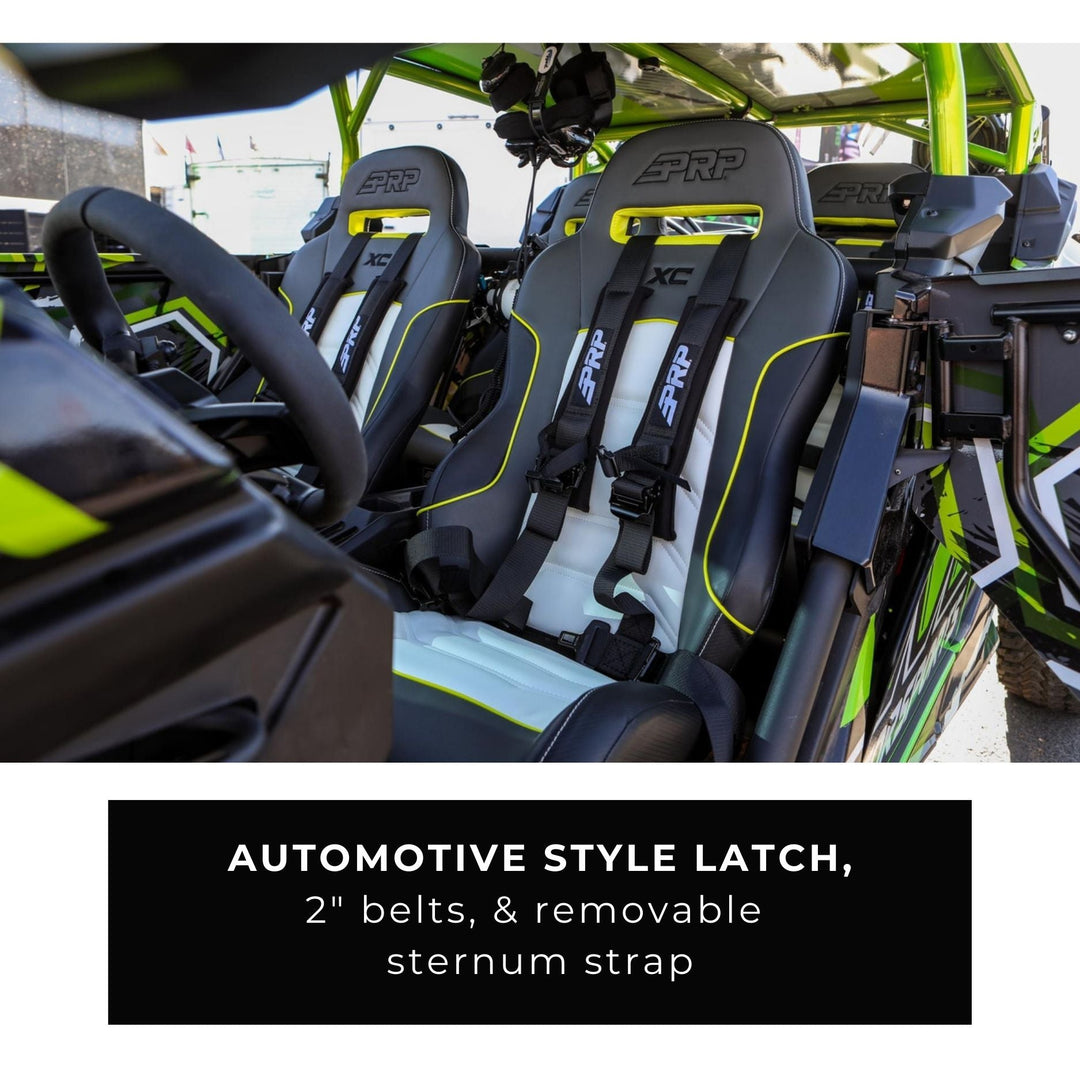 Seats with UTV 4 point seat belt automotive buckle of a vehicle with safety features labeled, featuring a green and black color scheme.