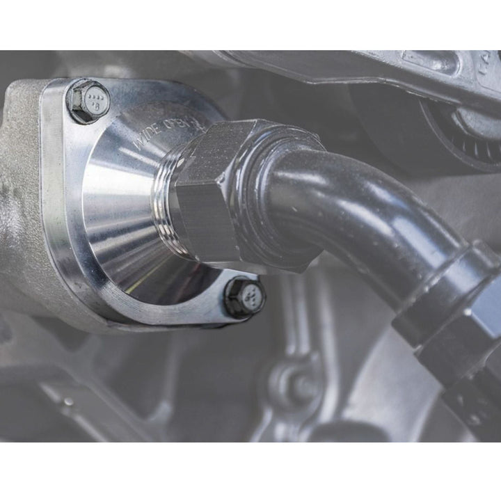 Close-up of a billet LS thermostat housing for tube chassis build with a metallic finish