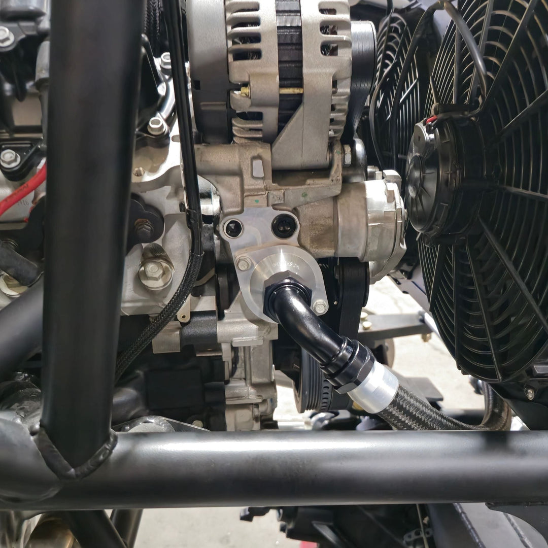 Close-up of a car engine with visible billet LT thermostat housing for custom build.