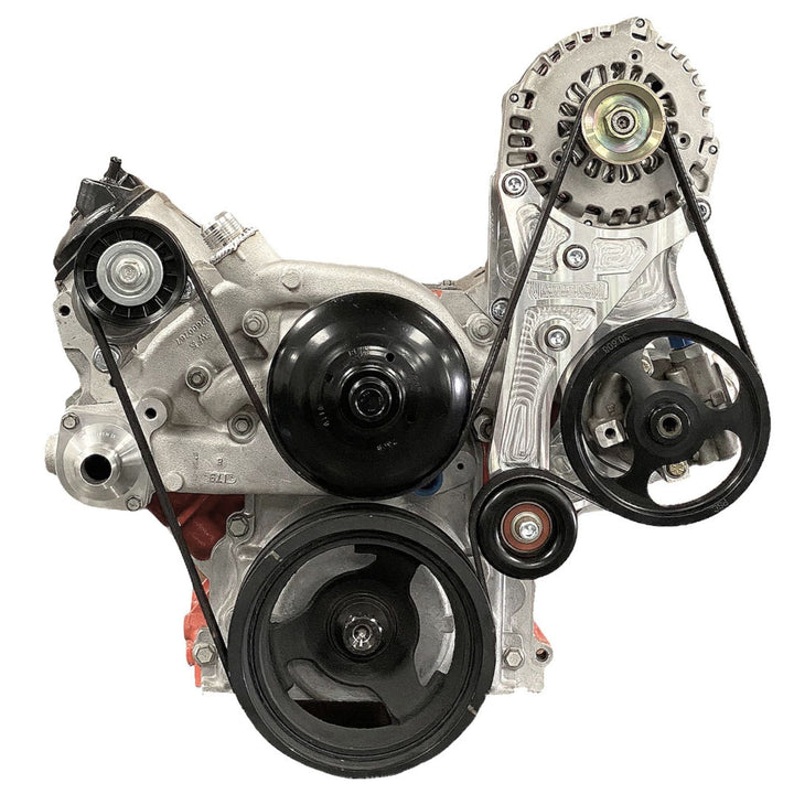 Car engine with belt system on a white background showing the power steering pump relocation kit in use