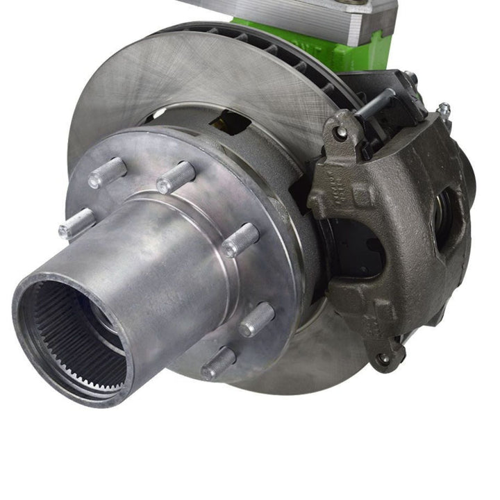 Close-up of GM Dana 60 complete knuckle hub brake kit installed on an axle on a white background