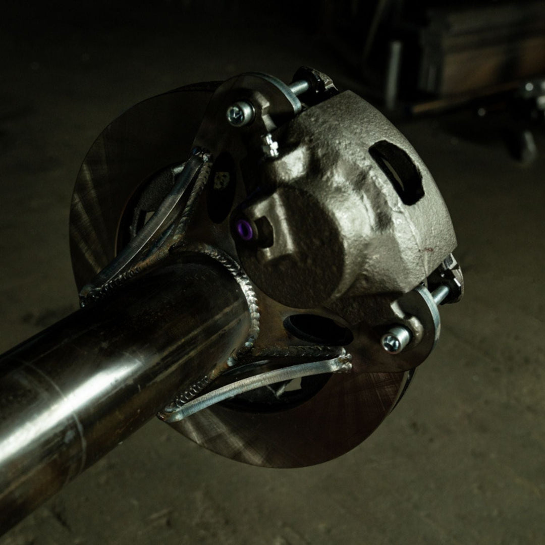 Close-up of a heavy duty rear disc brake kit for off-road rigs on an axle