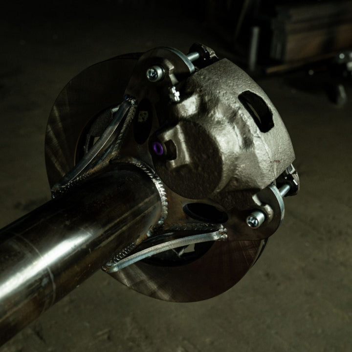 Close-up of a heavy duty rear disc brake kit for off-road rigs on an axle