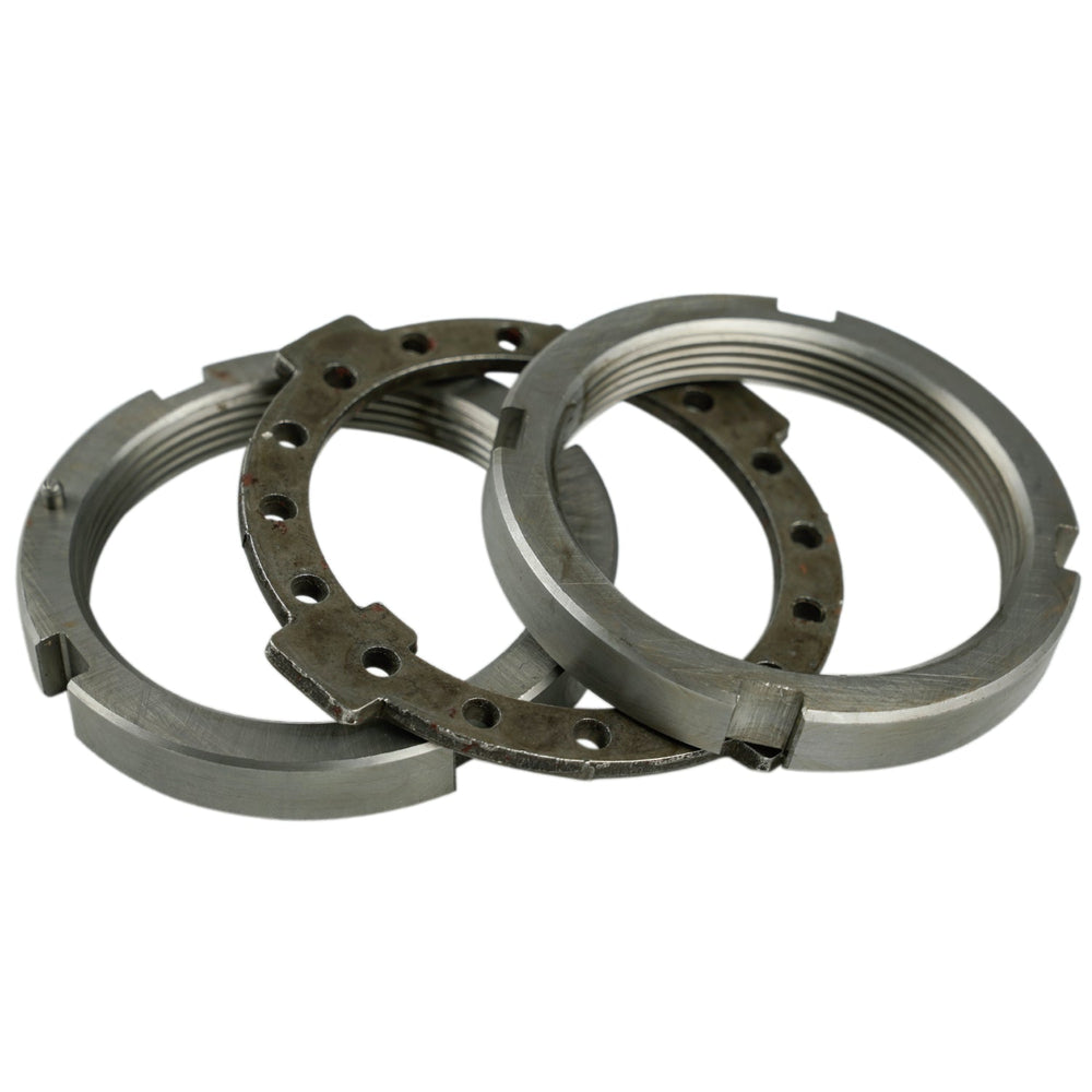 Three metal bearings stacked on a white background