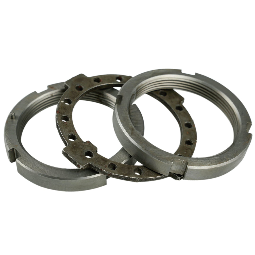 Three metal bearings stacked on a white background