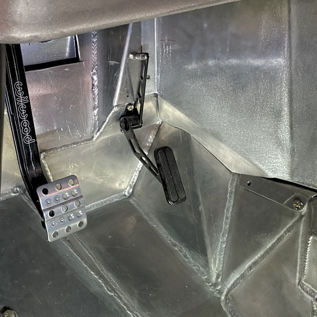 Metallic interior of a vehicle with lokar stainless throttle pedal and floor pan