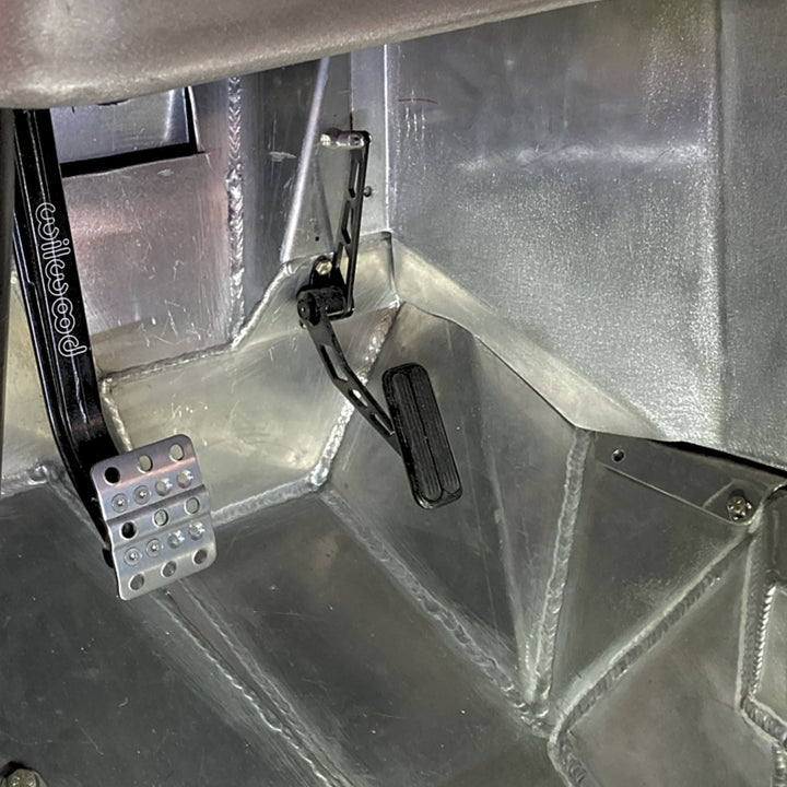 Metallic interior of a vehicle with lokar stainless throttle pedal and floor pan